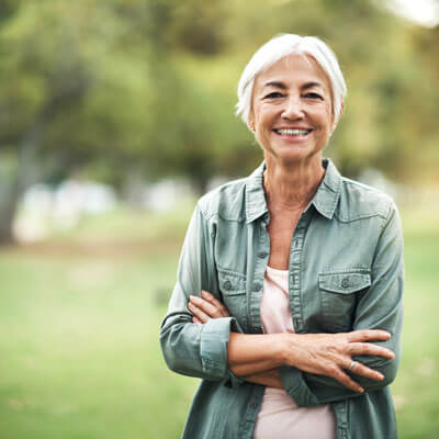 Senior woman outdoors smiling
